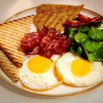 Potato pancakes with eggs and bacon